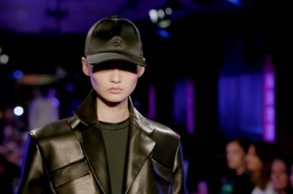 Tom Ford Spring Summer 2020. Black leather jacket with leather hat and black t-shirt, womenswear.