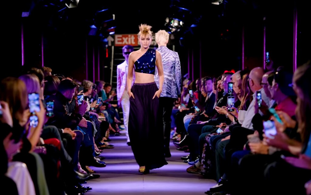Tom Ford Spring Summer 2020. Gigi Hadid wearing a chromed acrylic anatomical breastplate by Tom Ford, womenswear.