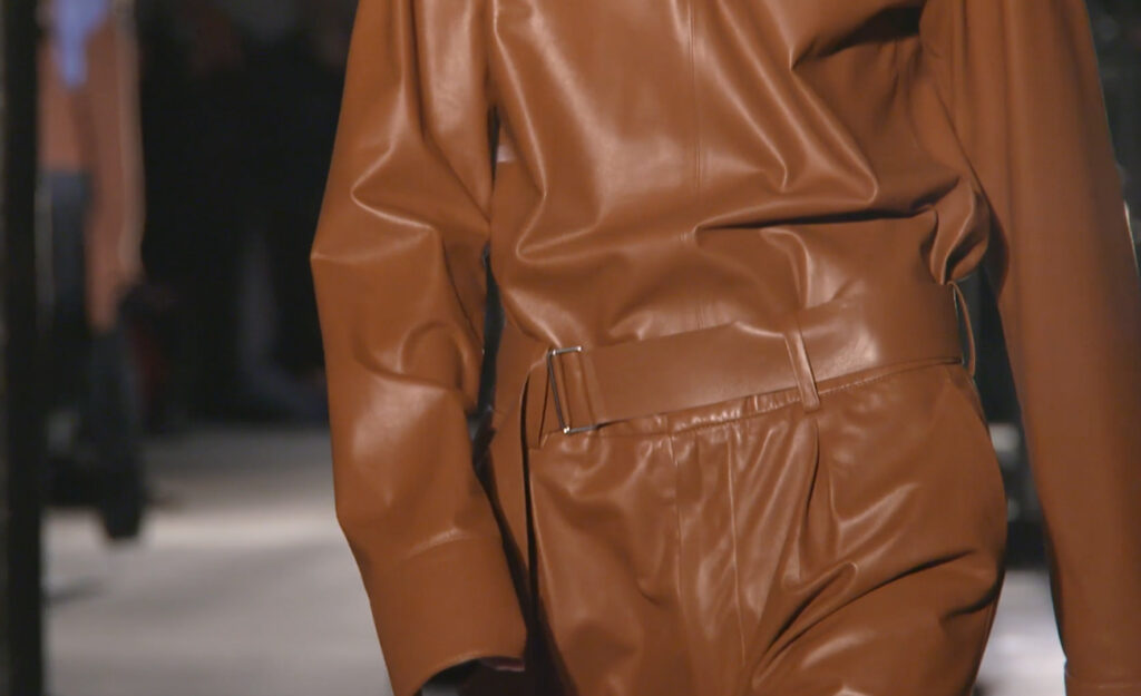 Close-up shot of an attractive brown leather jumpsuit. Chic Winter Looks by Alessandro Dell'Acqua and N21 Fall Winter 2020