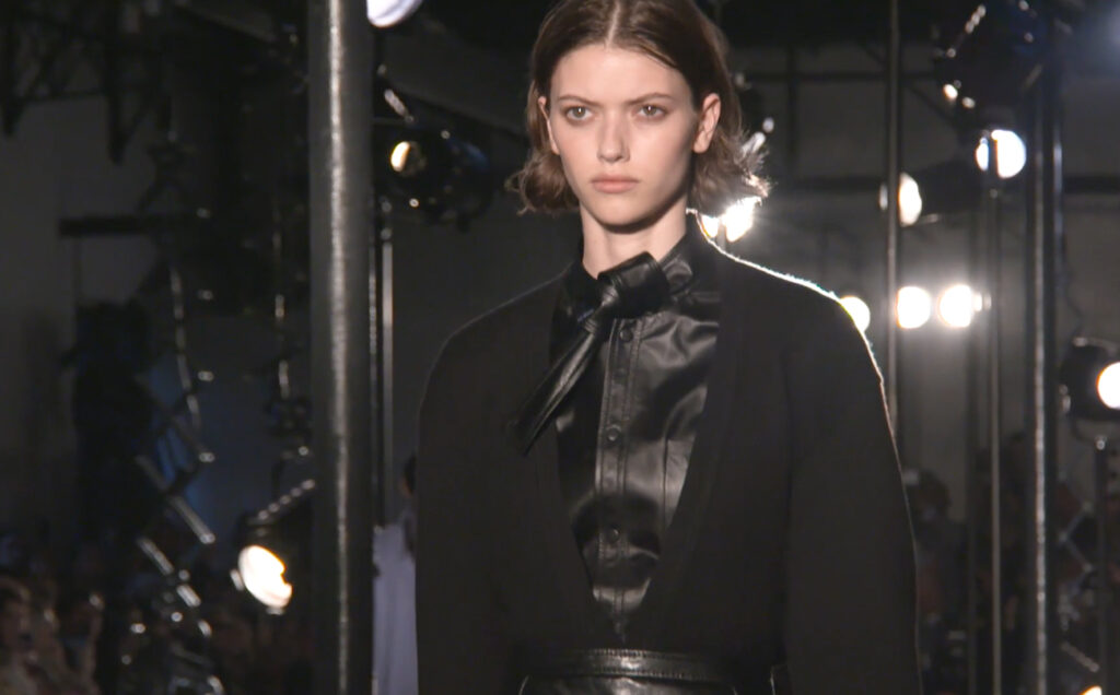 Black leather shirt with a black knitwear pullover close-up shot. Chic Winter Looks by Alessandro Dell'Acqua and N21 Fall Winter 2020
