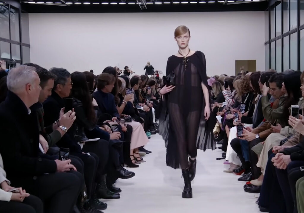Attractive transperant outfit and top cross shaped jewelry. A Symphony of Fashion with The Fall Winter 2020 Collection by Valentino