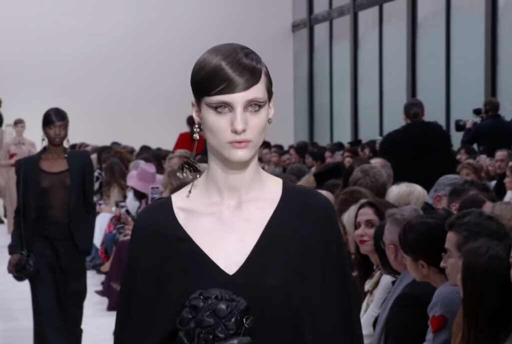 An attractive Valentino model close-up. A Symphony of Fashion with The Fall Winter 2020 Collection by Valentino