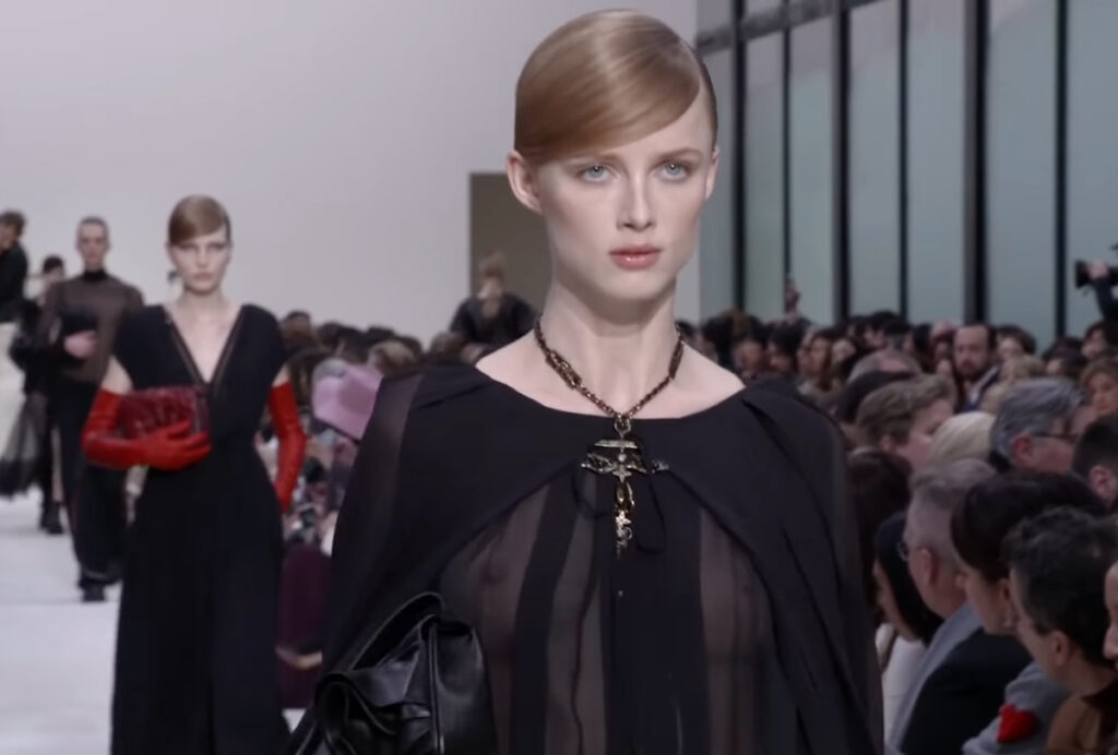 Attractive transperant top and cross shaped jewelry. A Symphony of Fashion with The Fall Winter 2020 Collection by Valentino